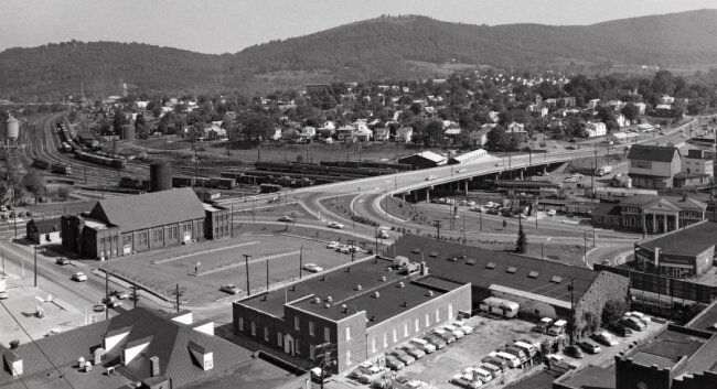 Downtown gateway or bypass? The Belmont Bridge seen here in the early 1960s. Notice the size of the rail yard beneath it and the on and off ramps that connect with East Main Street and Water Street. 
