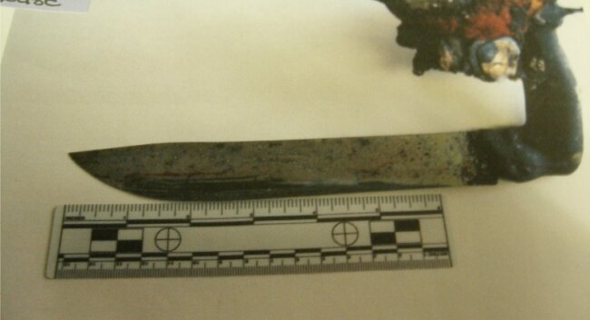 At first, investigators couldn%2526#039;t see this charred knife in Nola Charles%2526#039; back. 