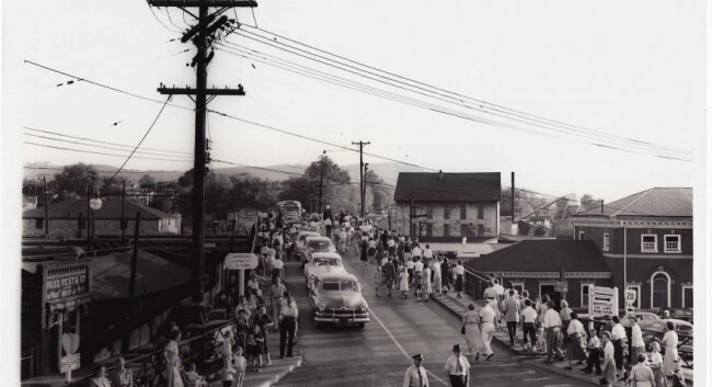 Built in 1905 and seen here on a parade day in 1951, a smaller bridge once spanned the tracks.