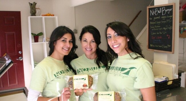 Crissanne Raymond (center), and her daughters Heather and Elizabeth, founders of No Bull Burger.