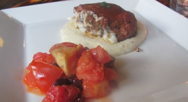 Smoked tomato braised pork shoulder with creamy gruyere grits.