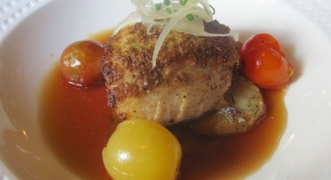 Poached cherry tomatoes with fennel-crusted snapper
