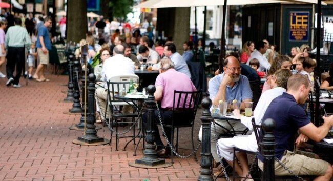 Outdoor cafés on the Downtown Mall are often packed in warmer weather, like the one at Rapture shown here, but a revised city ordinance will allow a handful of downtown restaurants to pack in more than others.