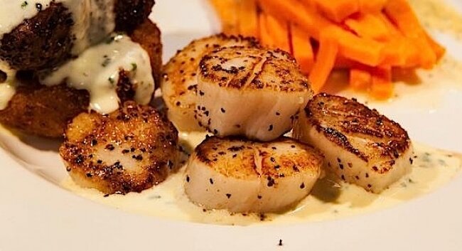 Some seared scallops and a tender cut from Burtons Grill, one of the restaurants participating in Restaurant Week.