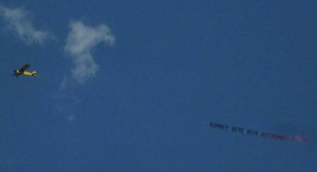 Many Charlottesvillians could see this event-touting banner flying overhead on Sunday afternoon.