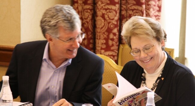 Provost John Simon and President Teresa Sullivan share a pre-meeting laugh.