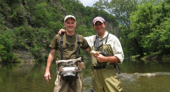 Dargan Coggeshall and his brother-in-law, Charlie Crawford, fishing-- illegally, some say-- on the Jackson River.