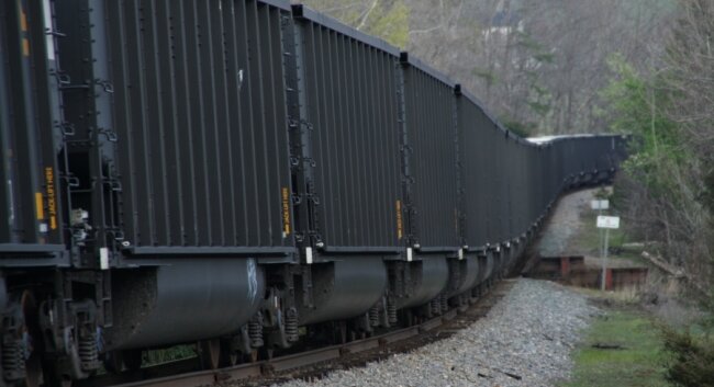 Viewed from an angle, the matte black matches the color of the cargo (although these are empties returning to the coal fields of West Virginia).