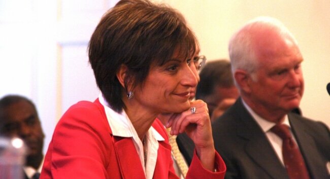 Helen Dragas listens to the reinstated president.