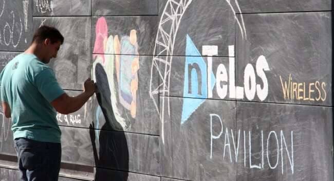 A few steps away, hired PVCC student-artist Jason Gaviria commemorates the event in chalk at the free speech monument