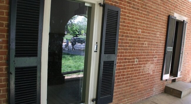 A glass door lets visitors peer-- but not step-- inside room #13.