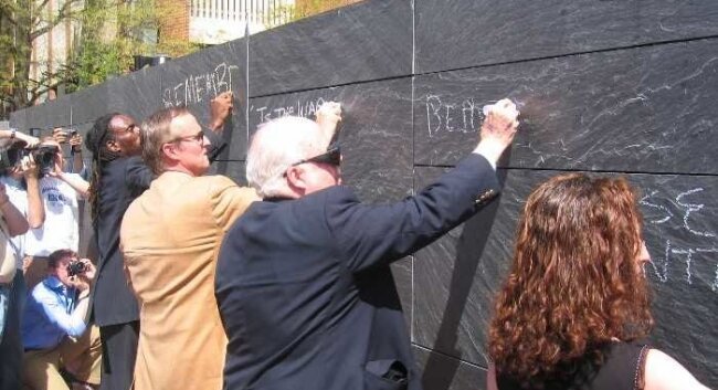 Boyd Tinsley, John Grisham, the late George Garrett, and Dahlia Lithwick at the dedication ceremony for the free speech wall in 2006