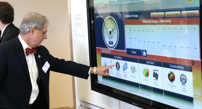 Technology investor and deep UVA donor Linwood Allen Lacy Jr. checks out energy consumption.