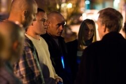 At a vigil on the one-year anniversary of Justine%2526#039;s death, Justine%2526#039;s father Steve Swartz, right, spoke with his former son-in-law Eric Abshire, center left in white sweater.
