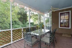 Screened porch overlooking terrace and back yard
