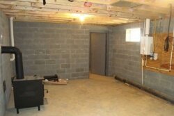 Unfinished basement with panic room beyond