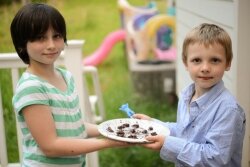 Landers’ children, Ida and Harry, show off their chocolate covered cicada creations.