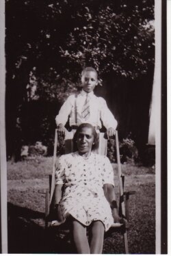 Young Eugene Williams stands behind his mother, Seppie.