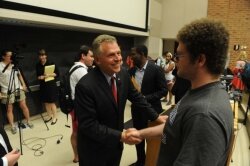 After explaining the key planks of his gubernatorial campaign in early April, McAuliffe greets students of Larry Sabato%2526#039;s introduction to American politics class. 