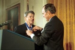 George H.W. Bush awards the Medal of Freedom to Ronald Reagan, who asked Congress to expand the death penalty from murderers to %2526quot;drug kingpins.%2526quot;