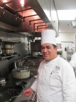 Boar%2526#039;s Head chef de cuisine Francisco Ayala prepares a mean tempura mittake mushroom