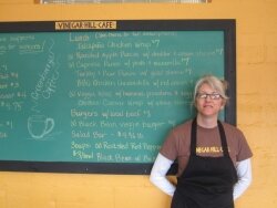 JABA community planner, Judy Berger, in front of a delicious, nutritious lunch menu.