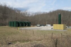 One of the first finished, productive shale gas wells in Doddridge County, West Virginia. The vent stack emits excess gas and visible fumes on a regular basis to the dismay of nearby residents.