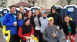Pre-race, the Charlottesville-based Boston Bounders, including Harry Landers, in the front row, in a gray fleece, gathered for a photo hours before devastation rocked the finish line.