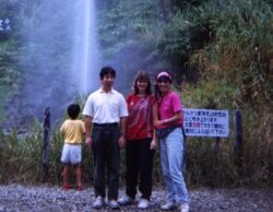 Shoh and Hiroko flank the author at a waterfall.