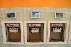 Bloop%2526#039;s brand of yogurt serving machines, complete with video displays where the name%2526#039;s of the flavors are listed.