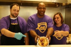 Sean Miles, owner Lou Renfrow, and Devy Shifflett offer up a cheesesteak.