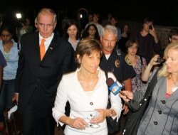 Helen Dragas leaves a BoV meeting at 3am June 19 during the height of the presidential ouster uproar, escorted by beer tycoon John Nau, III.
