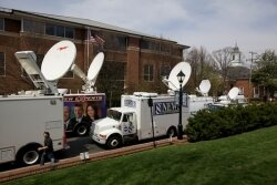 Satellite trucks filled Court Square for a Huguely preliminary hearing, and more are expected for the February trial. 