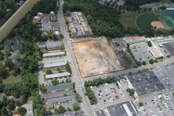 The 4.7-acre site is adjacent to the Millmont Shops, right, and Barracks Road Shopping Center, foreground.
