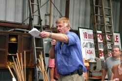 Auctioneer Dick Heatwole exhorts the bids upward for the 400 lots of Barnes Lumber equipment.