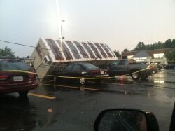 This trailer in the Barracks Road Shopping Center toppled onto some nearby vehicles.