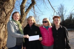 StreamWatch Director Rose Brown and Women Who Care member Pat Simpson joined Marie and Anders Beaurline for the donation.