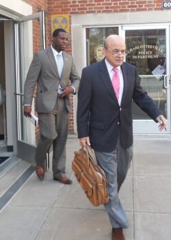 City Council candidate Wes Bellamy and defense attorney Ron Tweel leave Charlottesville General District Court.