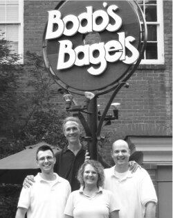 Bodos owner Brian Fox (at rear) hands the reins over to his general managers, Scott Smith, Connie Jenson, and John Kokola. 