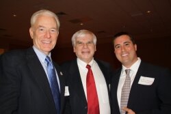 Terry Dickinson, executive director of the Virginia Dental Association, left, with Community Dental Center cofounder Bill Viglione, center, and board member D.J. Bickers at a February 9 fundraiser for the Center.