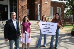 Bob Fenwick and Joanna Salidas talk of a %2526quot;dam scam%2526quot; while Erin Rose and Larry Bishop hoist a banner.