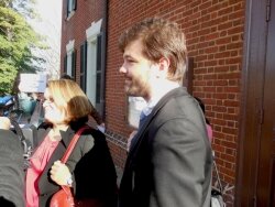 Chris Dumler faces the media and sign-waving citizens outside Albemarle Circuit Court.