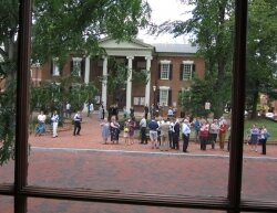 Lawyers and other legal eagles take refuge in front of the Albemarle courthouse after the earth shook.