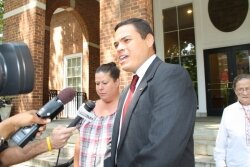 Flanked by character witnesses, James Halfaday briefly addresses reporters after his July 5 sentencing.