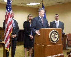 U.S. Attorney Tim Heaphy (at podium) credited multiple agencies for their work in convicting Harding, including, from left, Special Agent William Talbert with Virginia State Police, bankruptcy trustee Margaret Garber, and Albemarle assistant commonwealth%2526#039;s attorney Matt Quatrara.