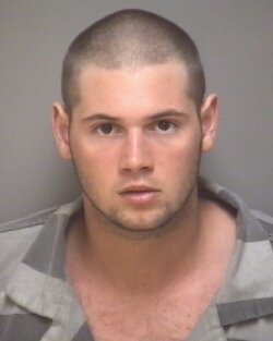George Huguely IV appears with shorter hair in a mugshot taken May 5, two days after his arrest.