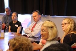 The topic of the Teresa Sullivan situation inevitably came up at a Tim Kaine coffee meeting with women, including Supervisor Ann Mallek (foreground).