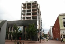 City officials, who required the old bank facade to become part of the 11-story hotel, have called the unfinished tower a %2526quot;blight.%2526quot;