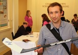UVA graduate student Jon Walter, who grew up playing hockey in Philadelphia, gets his old stick signed by the creator of the so-called %2526quot;hockey stick%2526quot; graph.