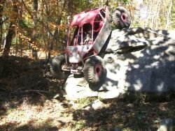 Rock crawling is pretty literally that, only you use a vehicle to do so. Heather Packard drives over a really big rock.